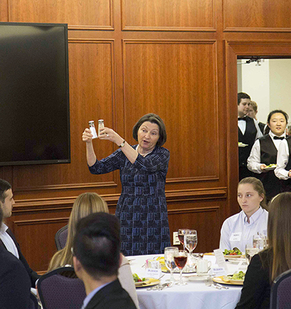 Students getting a demonstration at the 2017 Etiquette Dinner