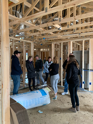 Students framing a Habitat for Humanity house during alternative Spring Break - 2019