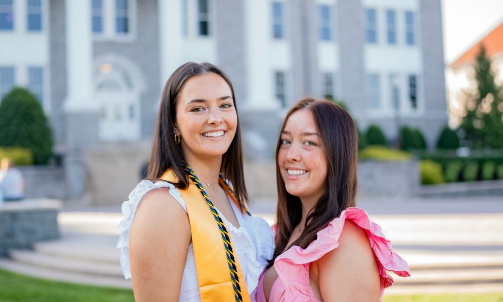 Sophia ('24) and Ella Carr in front of Wilson Hall