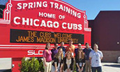 SRM Baseball Camp Group in front of Chicago Cubs Training Sign in March 2016