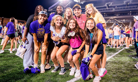 Group of students gathered together smiling