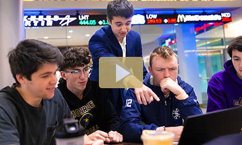 Group of students working at a computer together