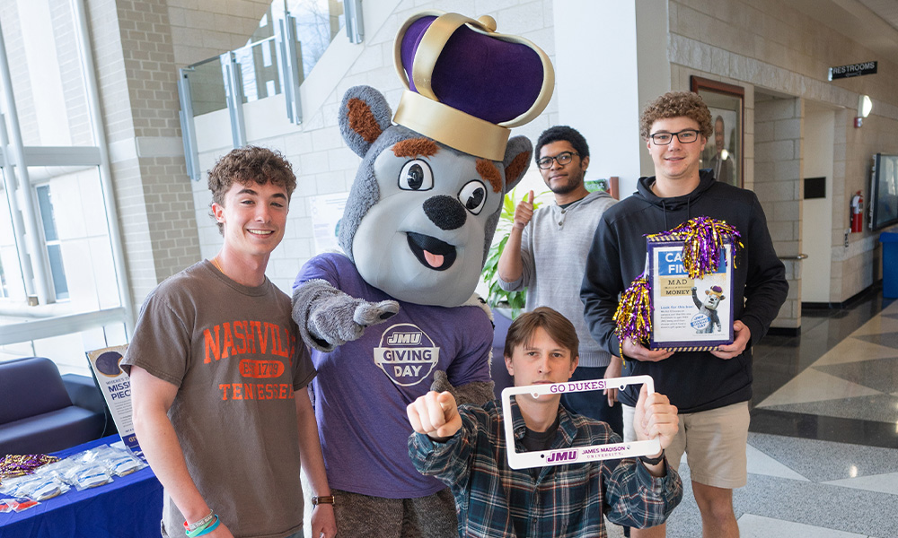 Students who celebrate the JMU day with a mascot and festive decorations.