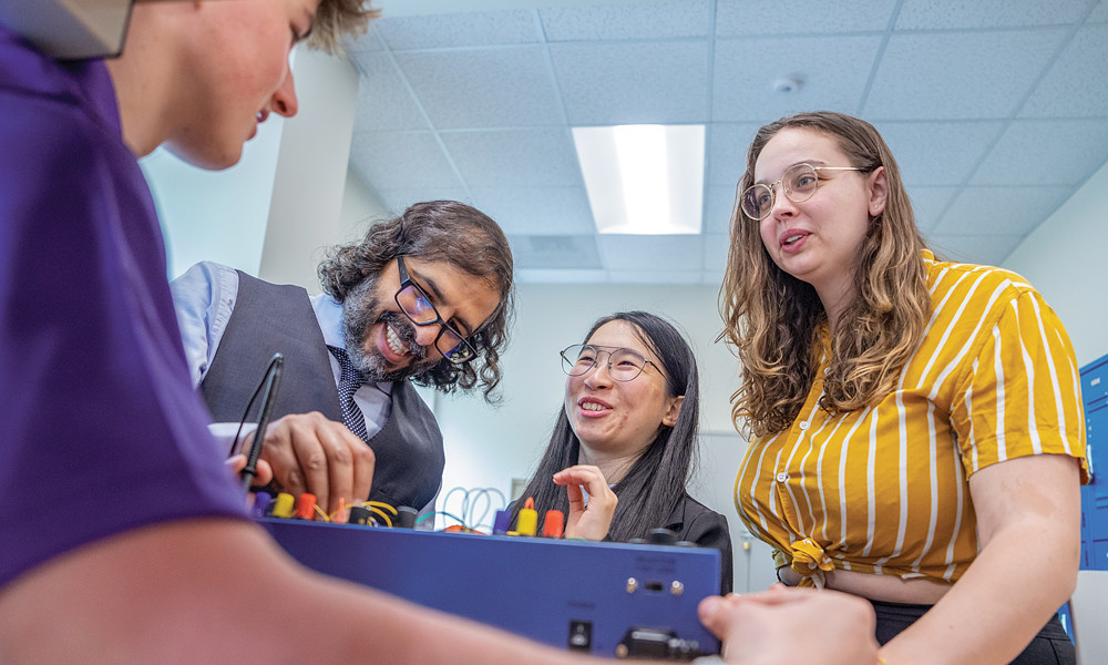 Students in the new Information Technology major participate in a circuitry demonstration with associate professor Ahmad Salman of the College of Integrated Science and Engineering.