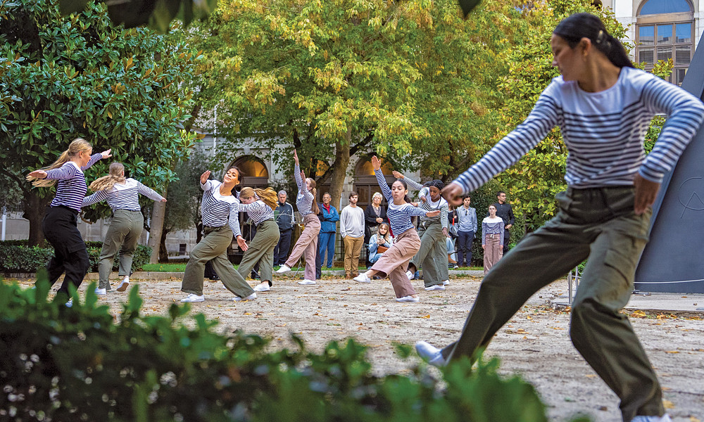 Dance and Music students led by Rubén Graciani, dean of the College of Visual and Performing Arts, perform a choreographed dance in an interior courtyard of the famed Museo National Centro de Arte Reina Sofía in Madrid on Oct. 20, 2023.