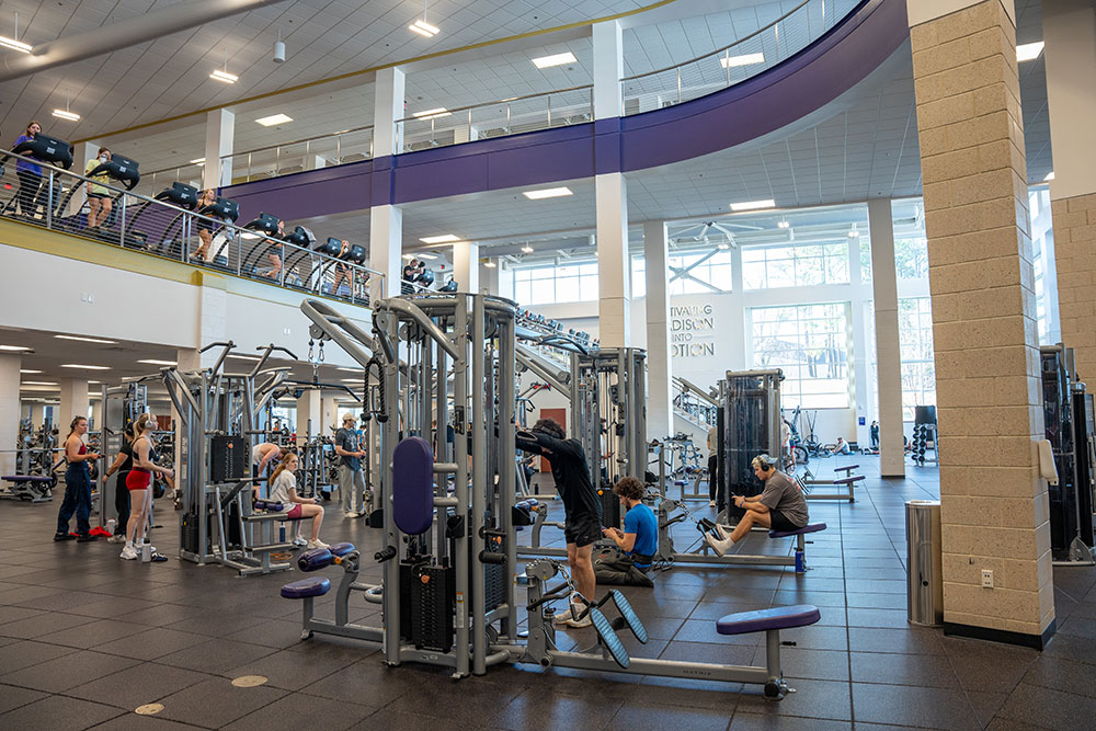 fitness center with cable machines and treadmills