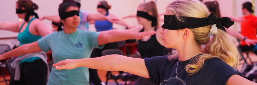 students participating in yoga blindfolded