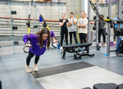 personal trainers showing how to do a bicep curl