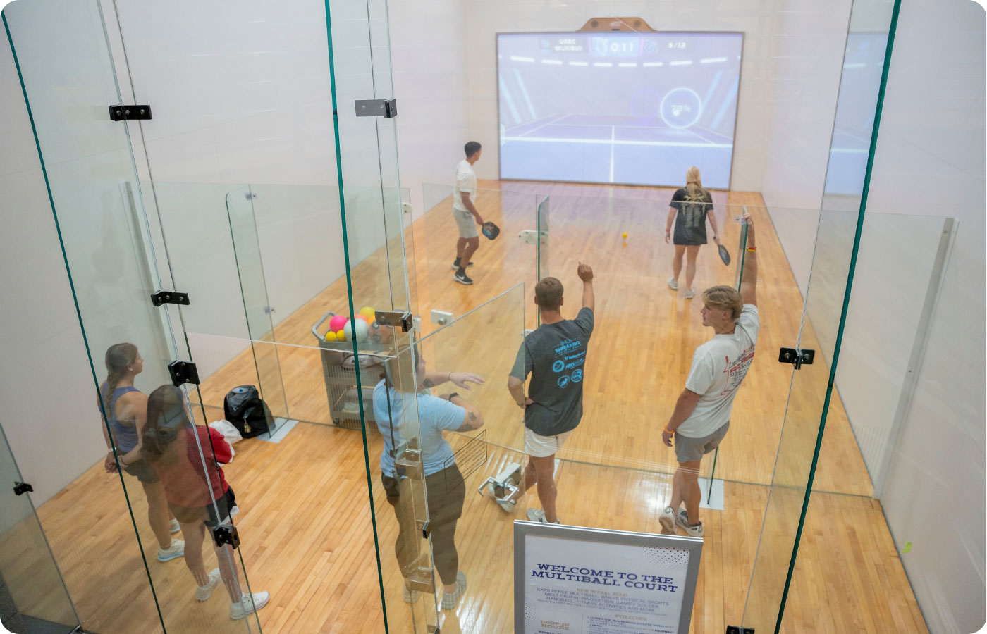 MultiBall space with student playing pickleball