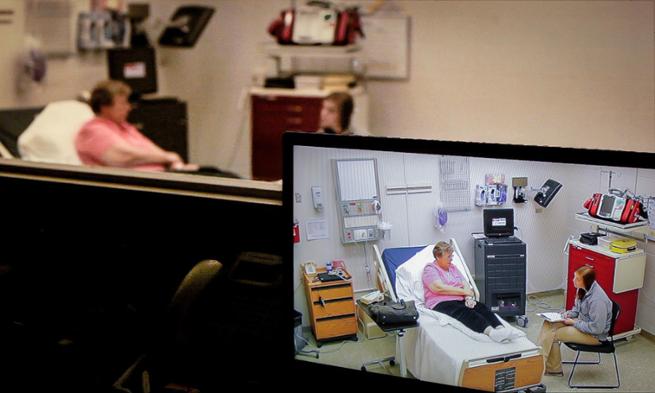 Photo of Emily Jolly interviewing professional patient Sue Thacker