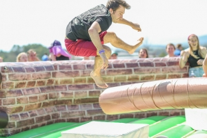 Image of Man jumping at a game during Madipalooza