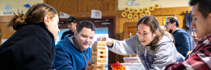 camp royall participants playing jenga