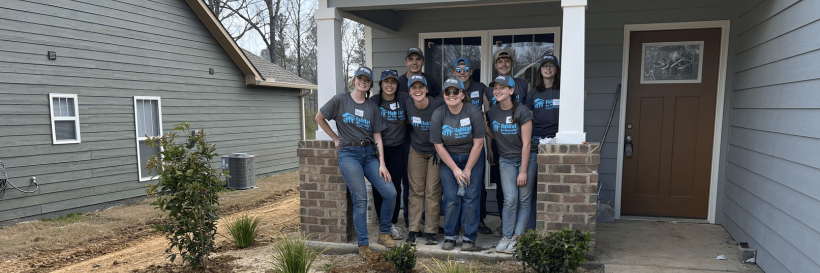 habitat birmingham group in front of home they helped build