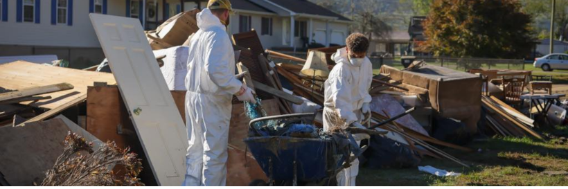 Two people clean up home destroyed by hurricane helene