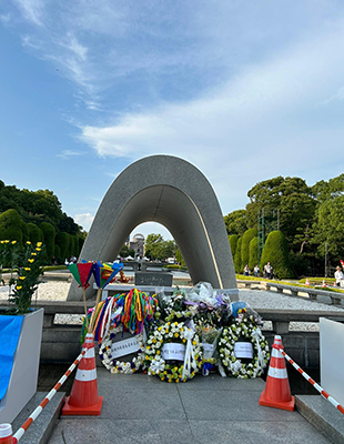 A memorial decorated with flowers to commemorate the anniversary of the atomic bomb dropping in Hiroshima at the Peace Ceremony.