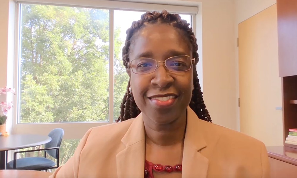 Dr. Vetria Byrd, Department Head of JMU Computer Science sitting at her desk in her office.