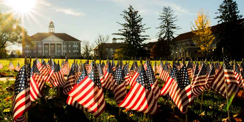 U.S. flags line the JMU Quad for Veterans Day