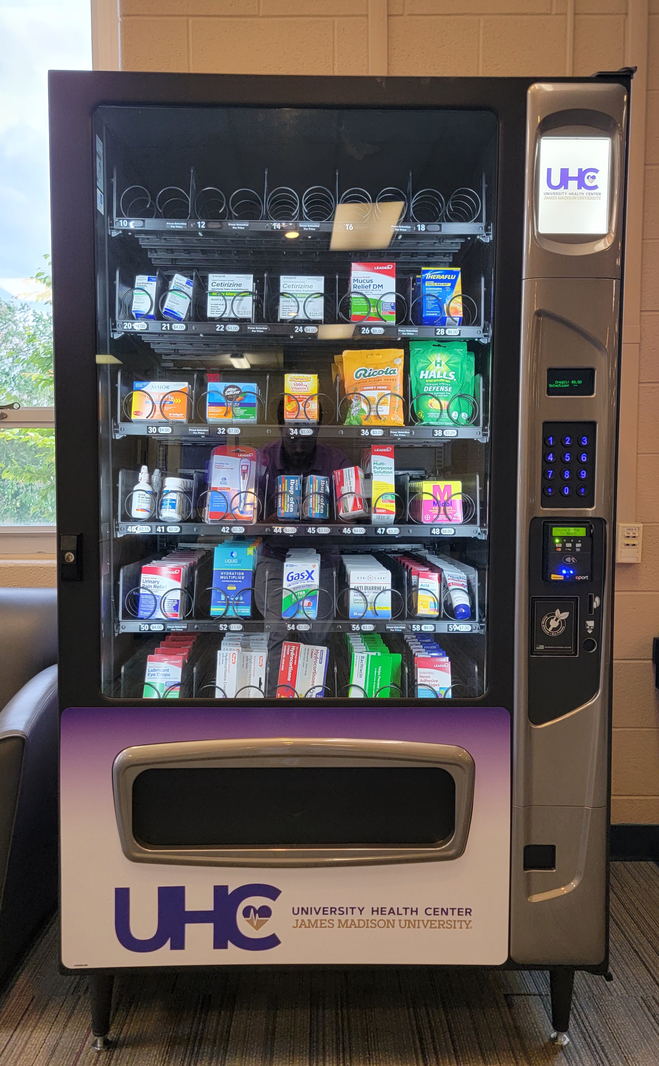 A vending machine stocked with over-the-counter wellness products.