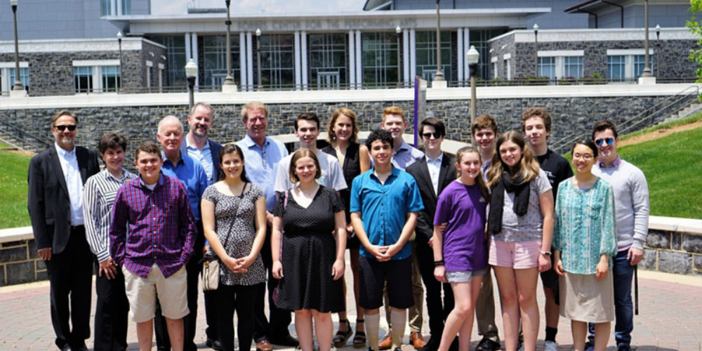 Piano day participants on quad