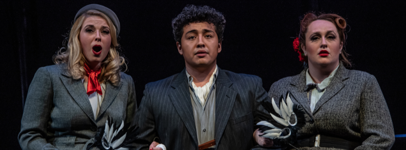 a woman, a man, and another woman in costume for opera