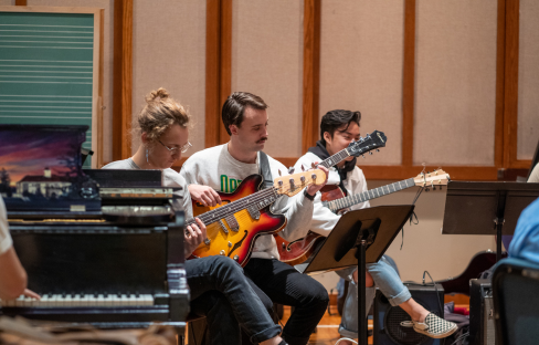 Guitarists playing together