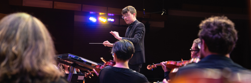 Man conducting orchestra