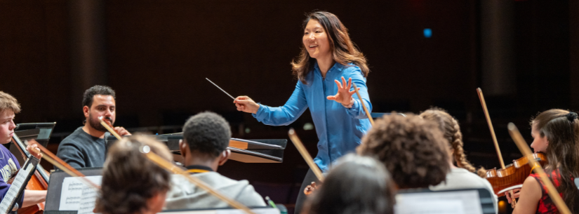 woman conducting orchestra