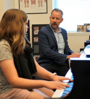 piano professor teaching a lesson