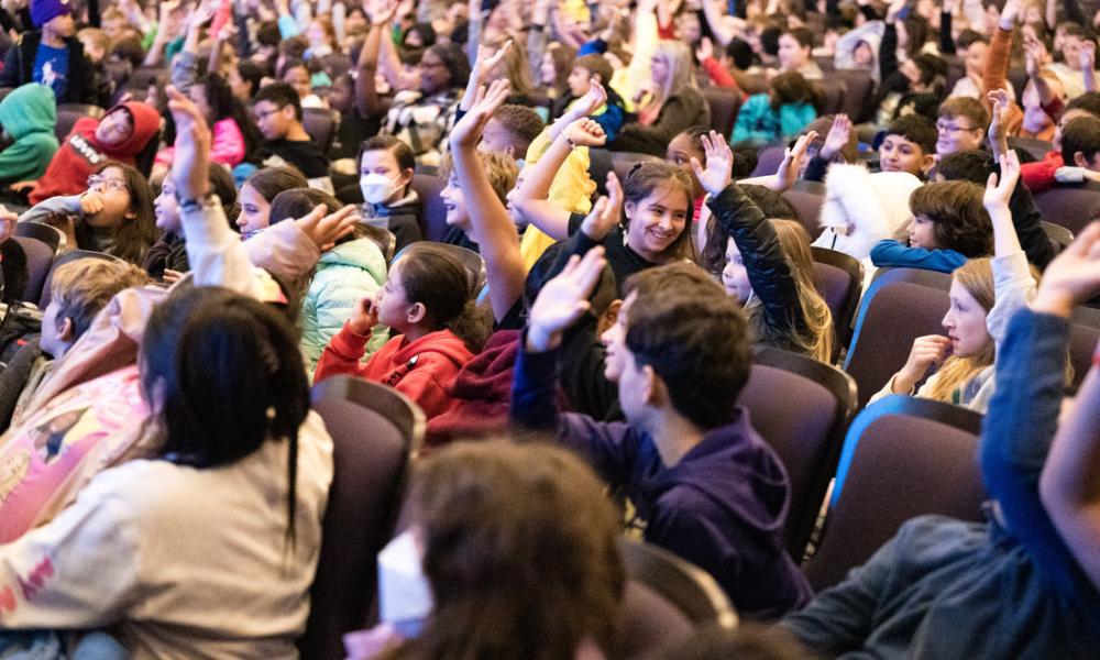 students in a theatre audience