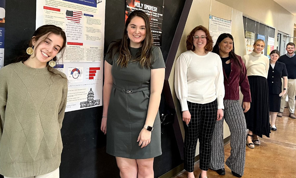 REL 460 Religion Senior Capstone students presenting a poster session at the 2023 Student Sustainability Summit, Harrisonburg, VA (photo by Frances Flannery)