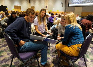 A group of CHBS students working in the poverty simulation