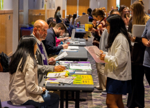 Volunteers working with CHBS students