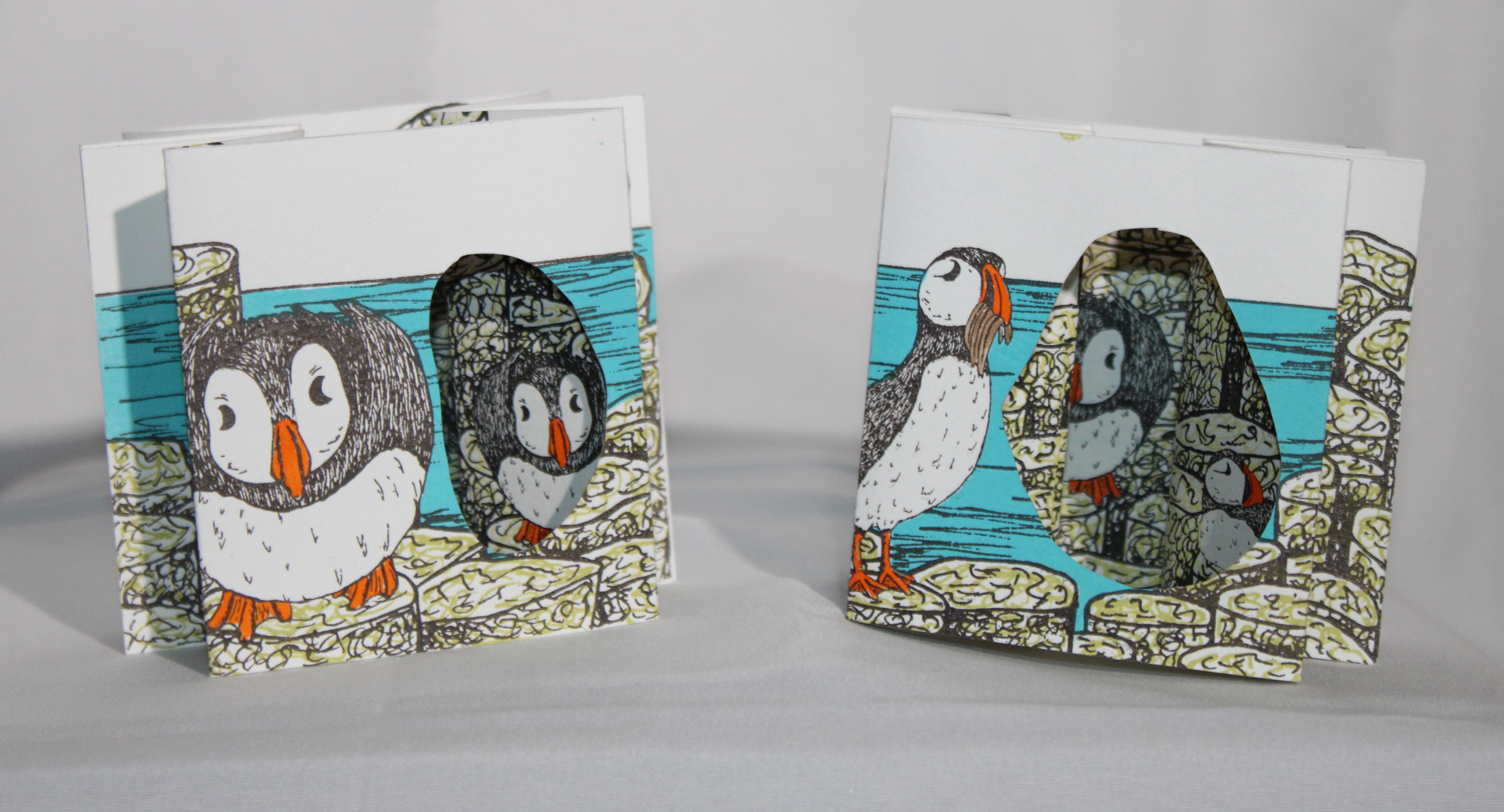 two matching artist tunnel books illustrated with puffins