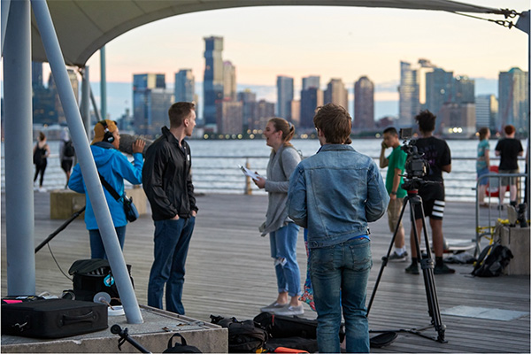 people talking on a film set